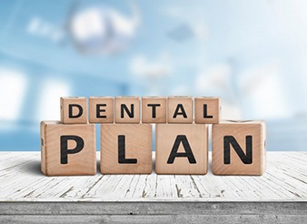 Blocks spell out “dental plan”